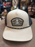 Tan trucker hat with pirate logo