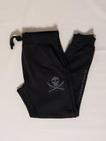 Black pants with a skull and crossbones design on a light background
