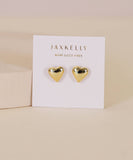 Gold heart-shaped earrings on a Jaxkelly branded card against a beige background
