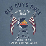 T-shirt with 'Old Guys Rule' graphic design featuring a barbecue and American flags on a blue background.