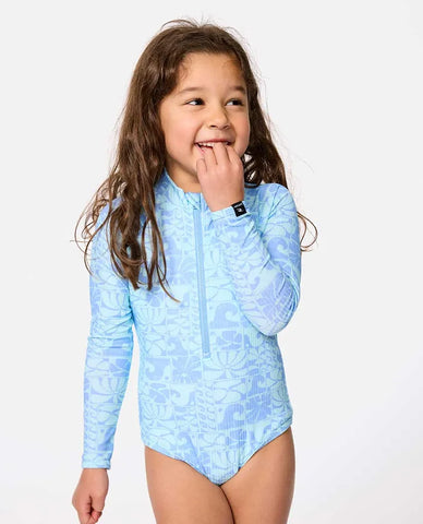 Young girl wearing a light blue patterned swimsuit on a white background