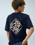 Child wearing a navy blue t-shirt with a floral salty crew logo on the back