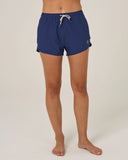 Navy blue shorts worn by a person on a white background