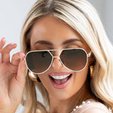 Woman wearing aviator sunglasses 