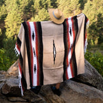 Person wearing a patterned blanket