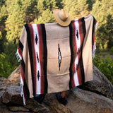 Person wearing a patterned blanket