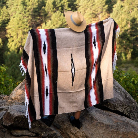 Person wearing a patterned blanket
