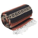 Folded blanket with striped pattern and fringes, featuring 'West Path' branding.