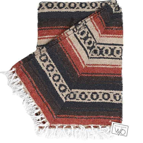 Woven blanket with geometric pattern and fringes