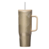 Gold-patterned mug with handle and straw on a white background
